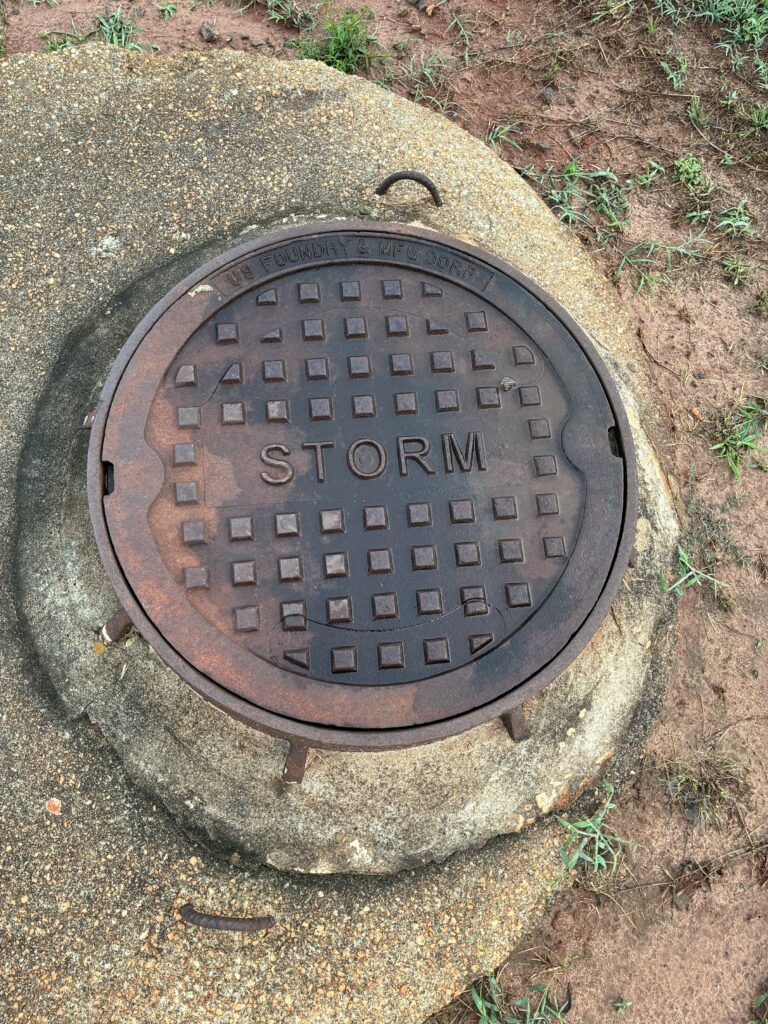 iPhone 16e storm drain manhole