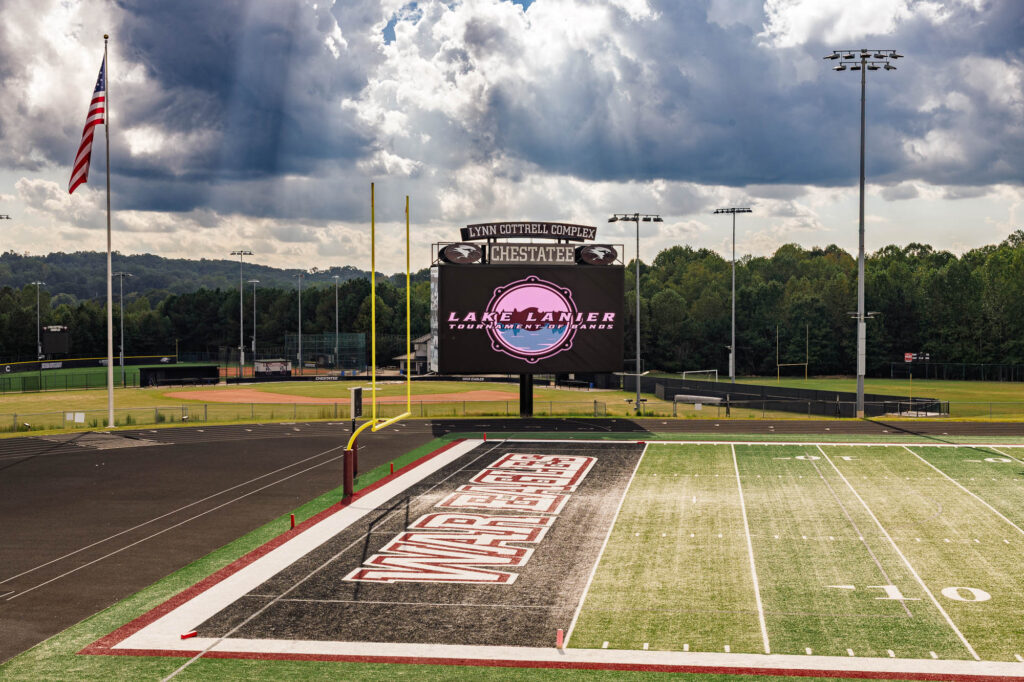 football field with Lake Lanier sign